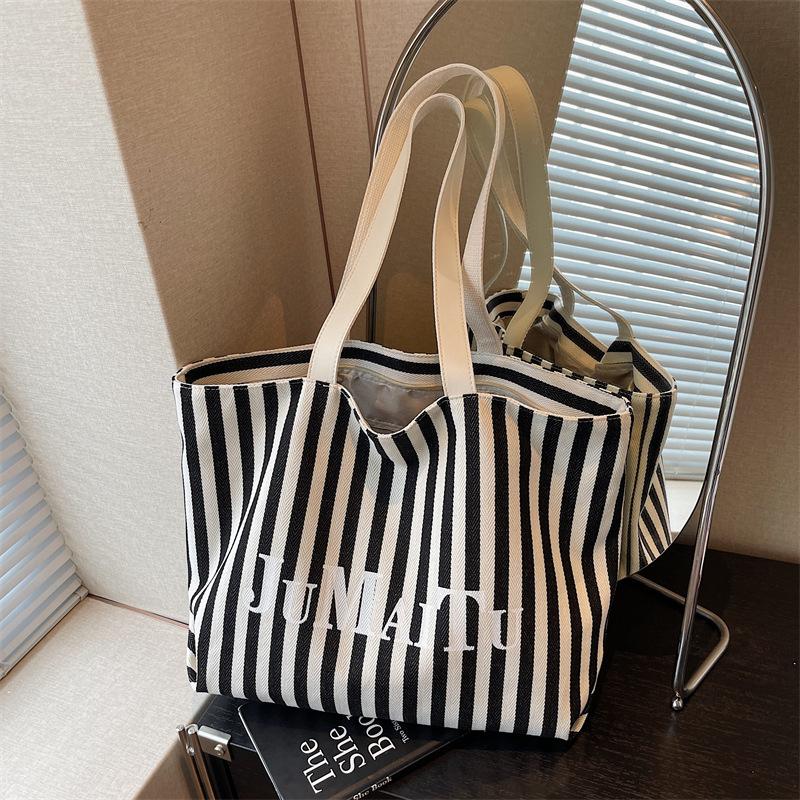 Niche design fashionable striped tote bag women's new large-capacity lazy wind shoulder bag canvas bag