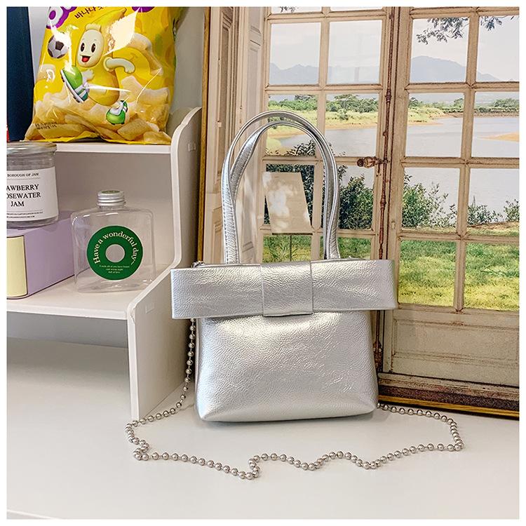 

2025 spring bow handbag cute pink sweet girl heart handbag fashionable texture messenger bag серебряный