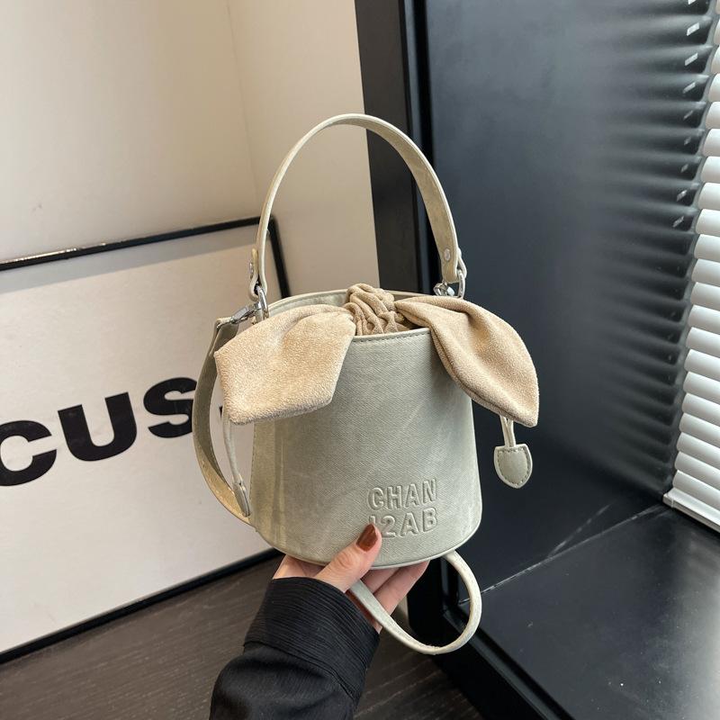 

2024 early spring new high-end retro shoulder messenger bag Korean version foreign style bow portable bucket bag female