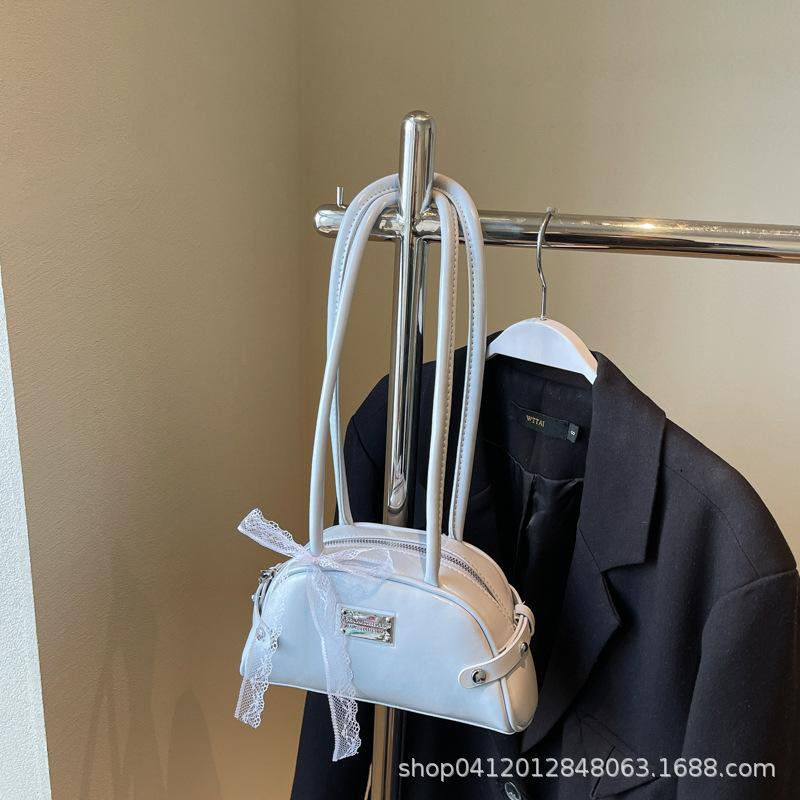 

Korean version portable bow large-capacity underarm bag 2025 spring new fashion shoulder bag shell commuter women s bag