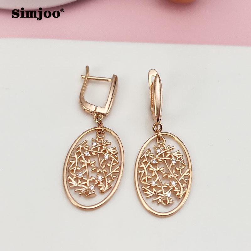 SIMJOO Różowe złoto Stylowe cyrkoniowe kolczyki z minimalnymi dzwoneczkami