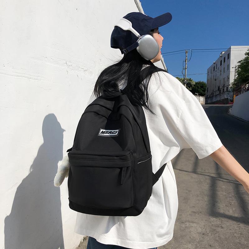 High-value schoolbag female Japanese ins large-capacity backpack solid color high school college student simple backpack