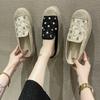 Straw fisherman slippers women 2025 summer new baotou low heel flat bottom rhinestone flowers leisure Internet celebrity half drag women