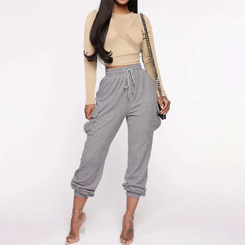 Top da donna estivo slim con corsetto a fascia svolazzante, girocollo e maniche lunghe