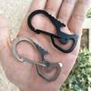 Creative Multifunctional Stainless Steel Keychain: Includes Bottle Opener, Carabiner & Flat-head Screwdriver.