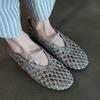 Sheepskin version~ French woven hollow and breathable niche flat-soled sandals women's summer shallow mouth one-word round head single shoes