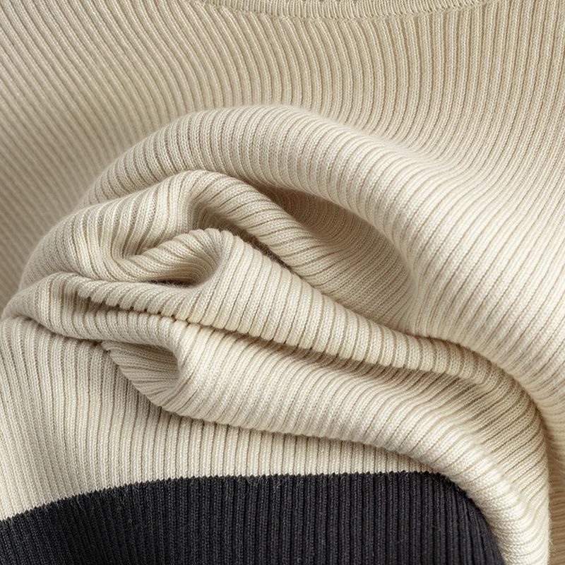 GMXIA Knitwear Set for Women's Autumn Design: A Two-piece Outfit Featuring A Contrasting Color Round-neck Top and A Slit Skirt, Exuding Elegance