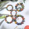 Mother-of-Pearl Lacquer Bead Bracelet with Multi-Treasure Buddhist Design