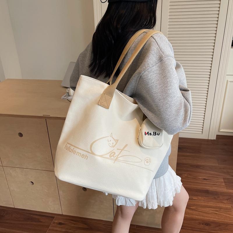 Korean version of simple niche trendy cartoon canvas bag women's autumn new large-capacity commuter portable shoulder tote bag