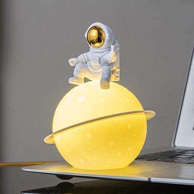 Astronaut Night Light Planet Lamp: Luminous Moon Ornament for Bedroom Decor, Gift, or Souvenir with Silk Flower.