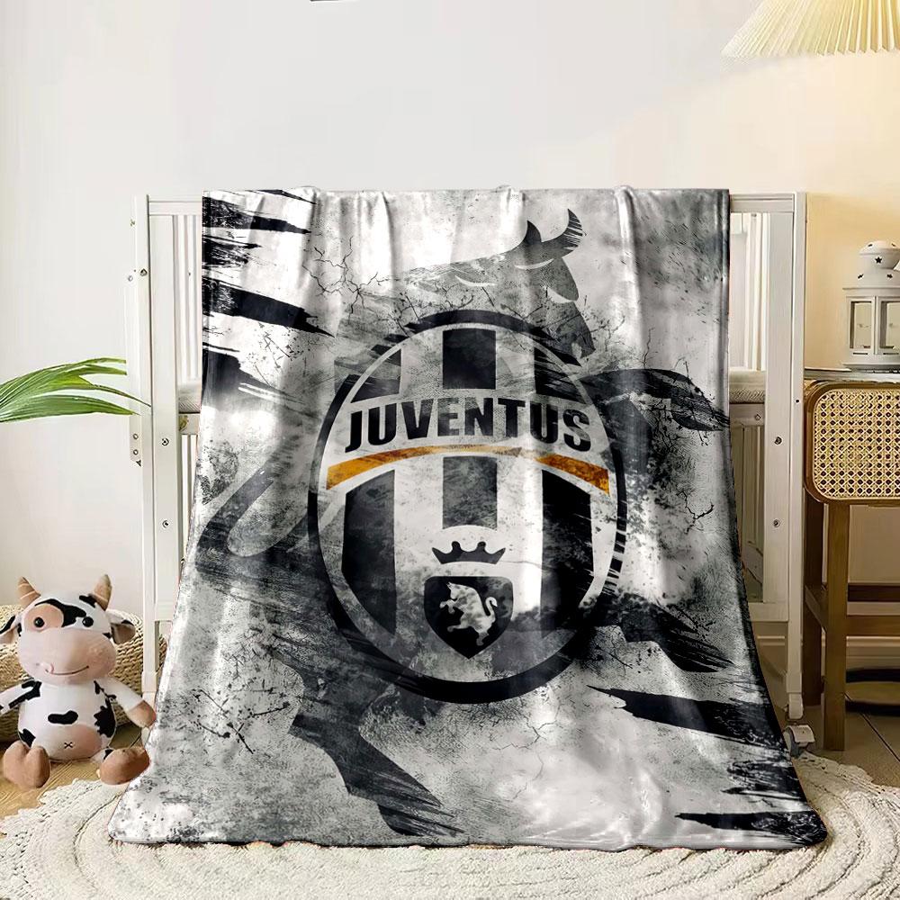 A Juventus logo with a bull silhouette on a textured, abstract background. for all seasons blanket lunch break throw gift
