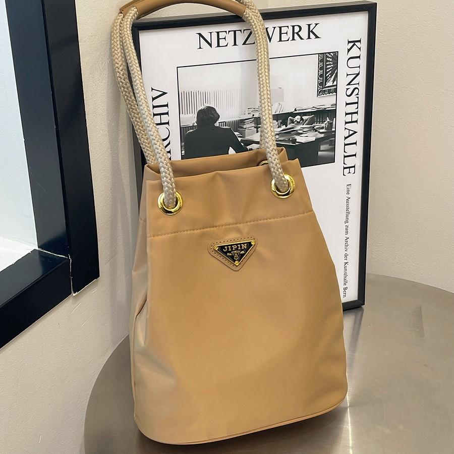 Versatile New Triangular Standard Nylon Canvas Bag Mini Niche Bucket Bag Double Chain Drawstring Single Shoulder Handbag Women