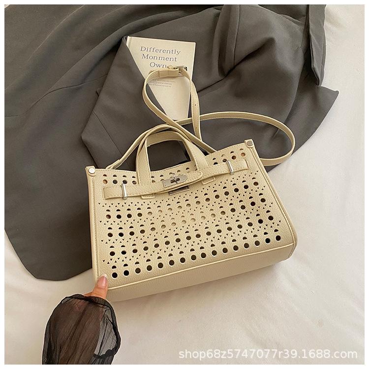 High-end cut-out handheld tote bag for women 2025 new fashion design large-capacity commuter mother-in-law bag crossbody bag