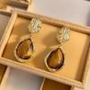Vintage Amber Water Drop Earrings for Women - Retro Hong Kong Style, Elegant Studs, Light Luxury Fashion.