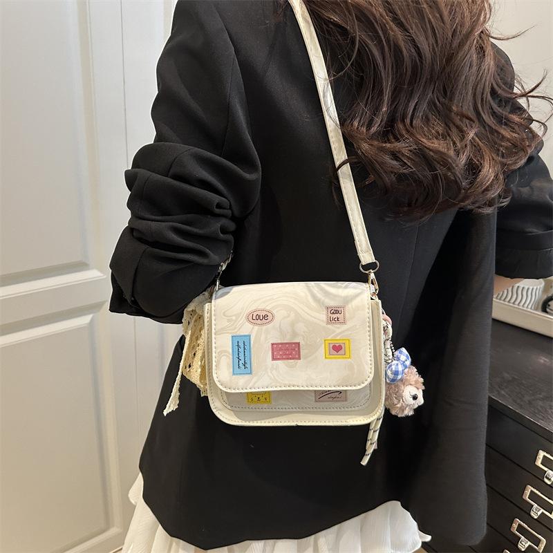 Versatile and foreign style spring new simple small square bag women's fashion high sense temperament light luxury design messenger bag
