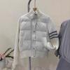 Wear a small short white goose down jacket for women's autumn and winter new knitted splicing niche