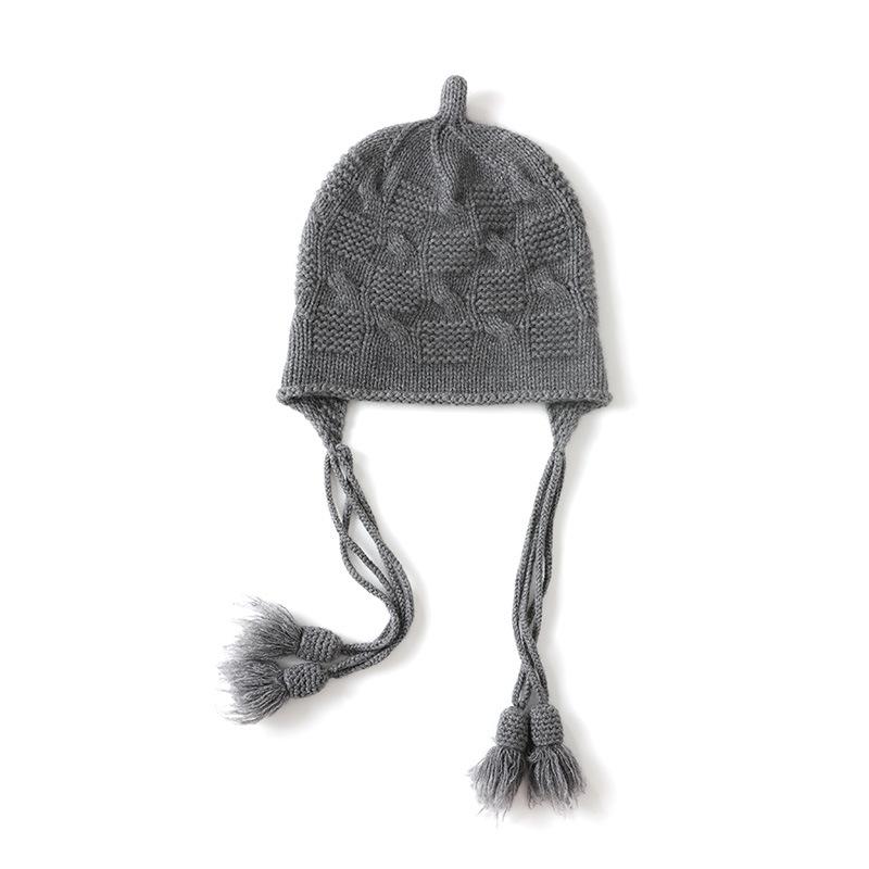 Autumn and winter new commuter women's knitted wool hat warm ear protector fringed pendant handmade twist all-match hat