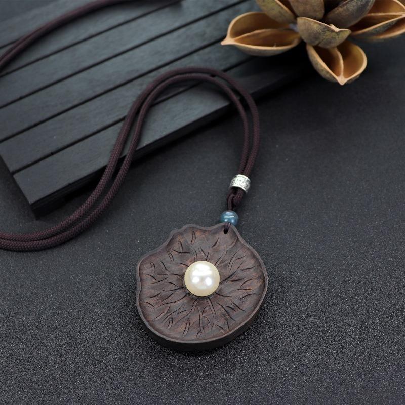 

Retro literary and artistic long ebony necklace wooden pendant women s simple Zen sweater chain cotton and linen accessories