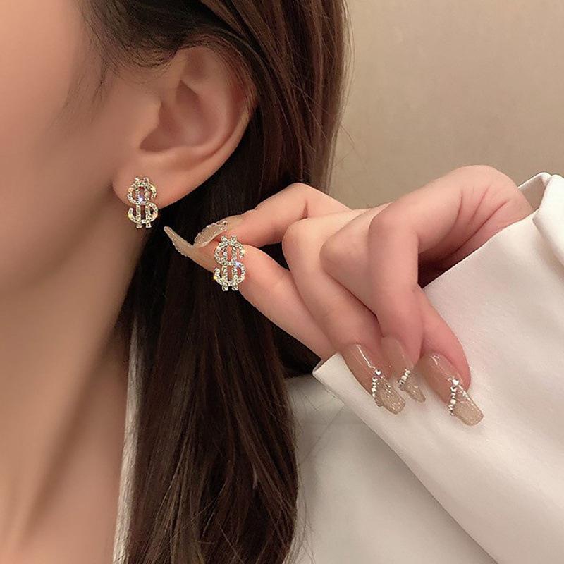 Exquisite Euro-Style Rhinestone Dollar Sign Stud Earrings – Versatile, Luxurious Jewelry for Women.