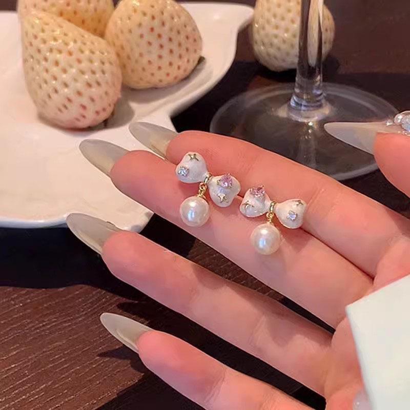 

Серебряные серьги-бантики в корейском стиле с фиолетовым цирконом A1672 золотой