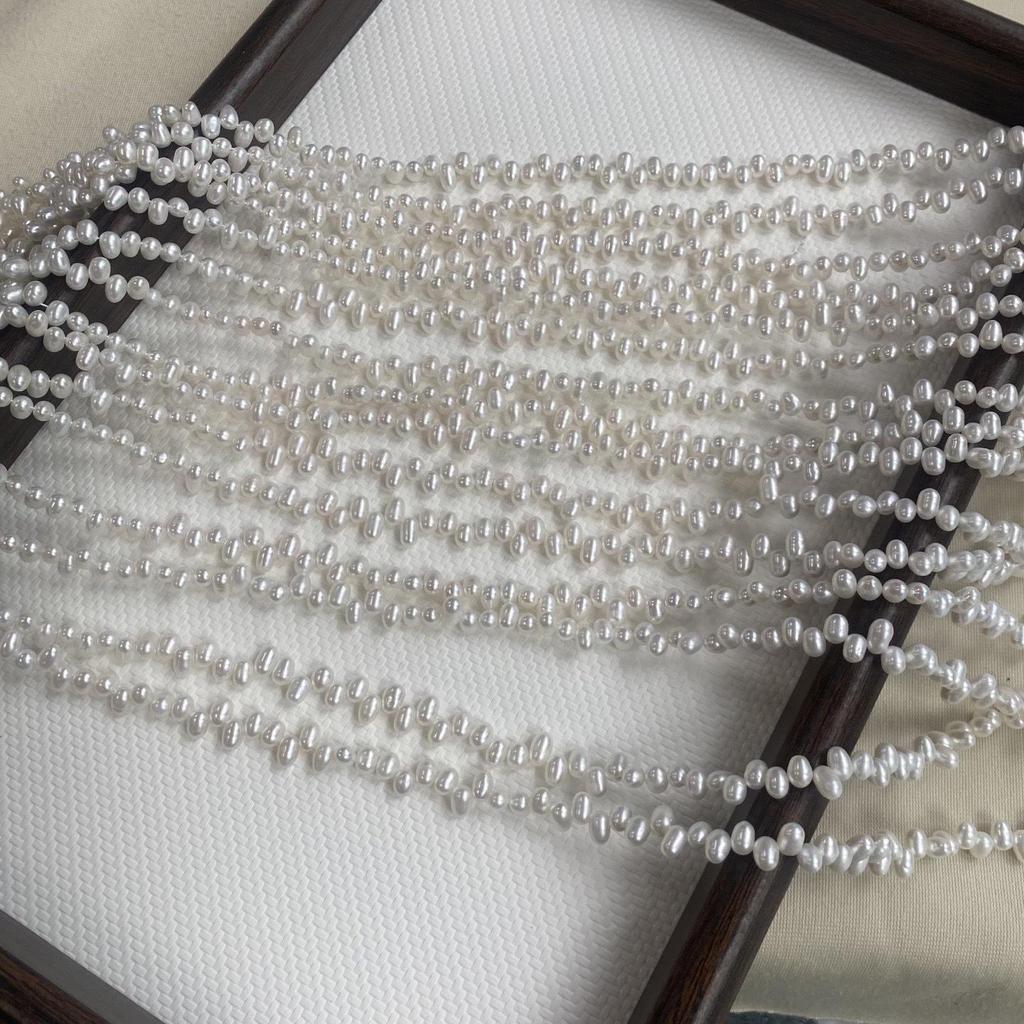 Natural Freshwater Rice-Shaped 4-5mm Necklace Beads with Tiny Flaws and Two-Eight Hole Design for DIY Jewelry.