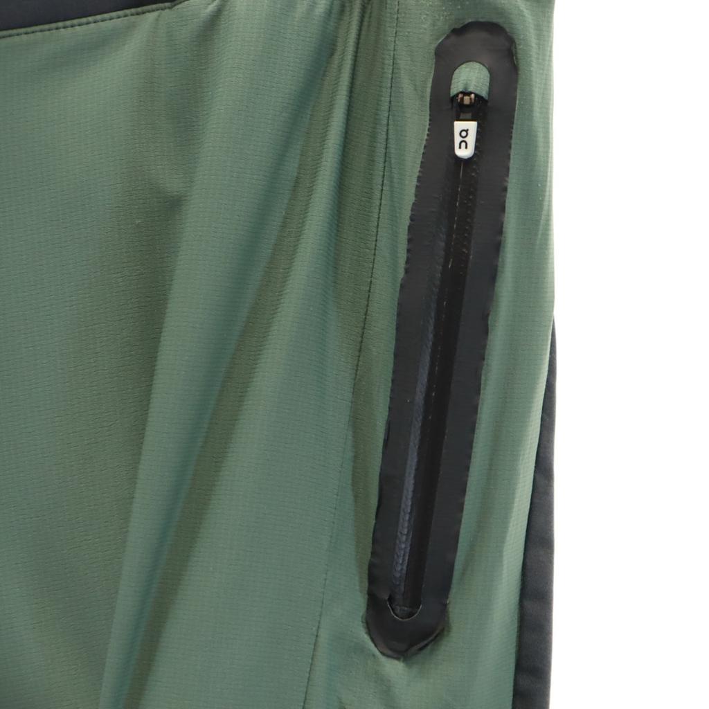 QN běžecké kalhoty L Zelený systém Pánské Použité