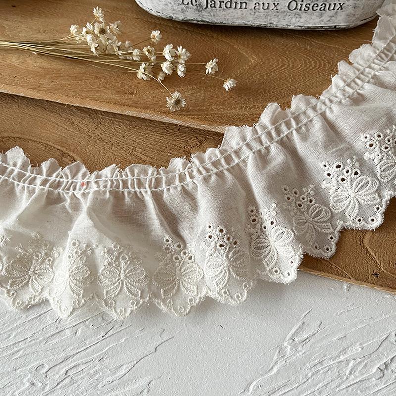 

2 метра/лот 7 см шириной Хлопчатобумажная вышитая кружевная ткань с бантом-складкой Женская юбка Край Манжета Декоративное кружево Аксессуары 2meters бежевый