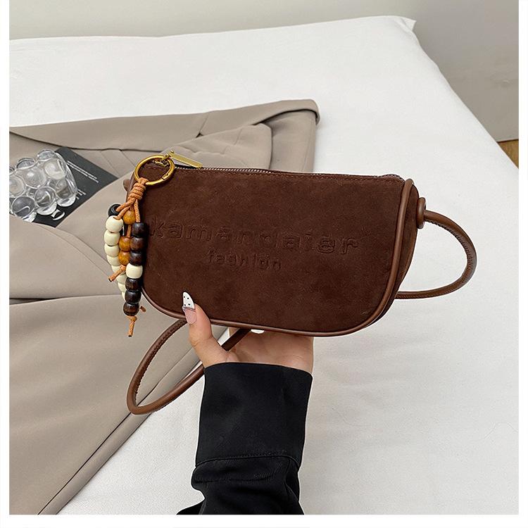 

Korean version of fashionable simple women s bag 2025 autumn new solid color small square bag niche casual commuter shoulder messenger bag