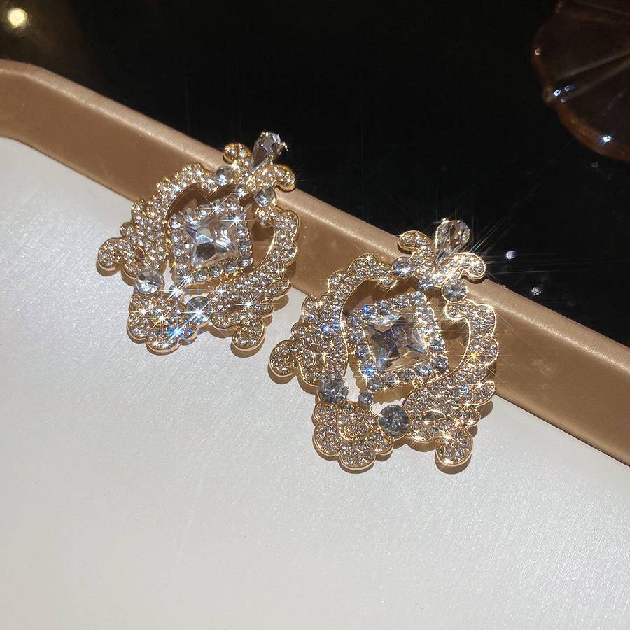 Silver Needle Retro Geometric Rhinestone Floral Hollow Stud Earrings - Elegantly Fashionable for Women