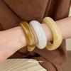 Acrylic Oval Open Bangle with Irregular Design - Elegant and Versatile Hand Jewelry.