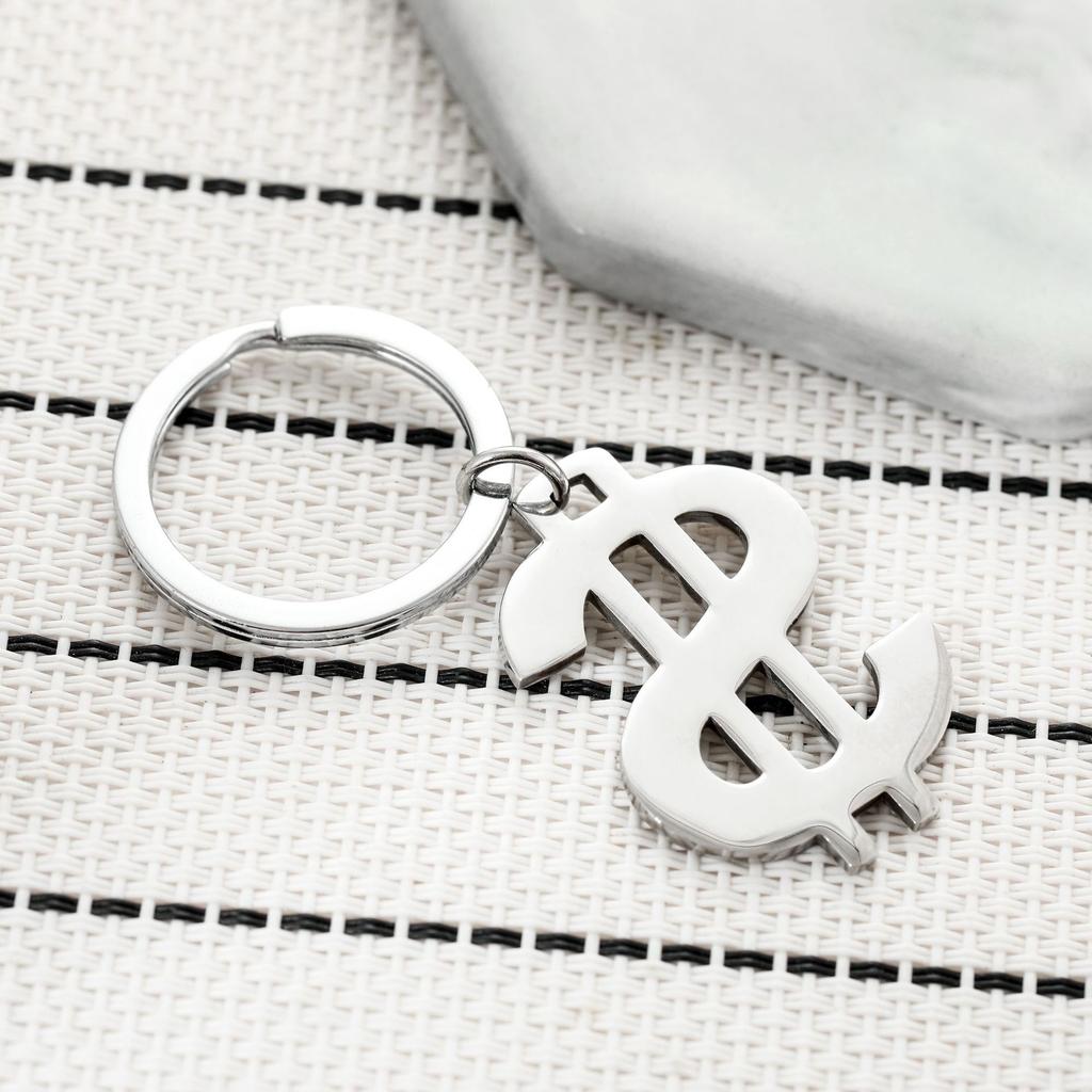 Symbol amerického dolaru Klíčenka z nerezové oceli Módní design měny Stylový přívěsek na klíče od auta Praktický denní doplněk ke klíčům