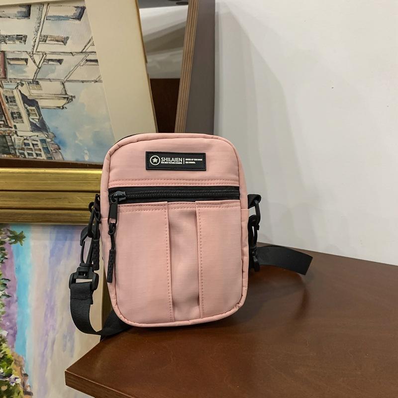

Men s and women s small bags niche design 2025 spring trend simple fashion foreign style oblique span bag casual personality small square bag рожевий