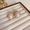 French Retro Pearl Geometric Earrings: Exaggerated Fashionable Studs for Women.