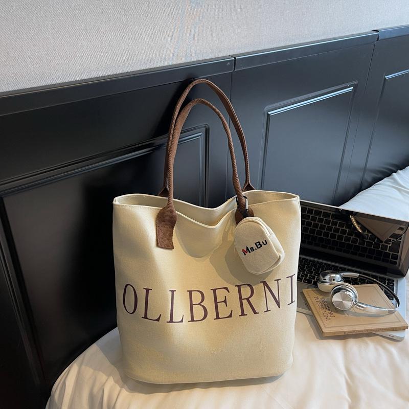 

Korean simple letter shoulder bag 2025 autumn new fashion foreign style canvas bag commuter large capacity shopping bag without pendant темно-коричневого кольору