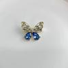 2024 Neue Gold Eingelegte Blaue Kristallbrosche Trend Internet-Berühmtheit Explosion Schmetterlingselement Mode Leichte Luxus-Accessoires