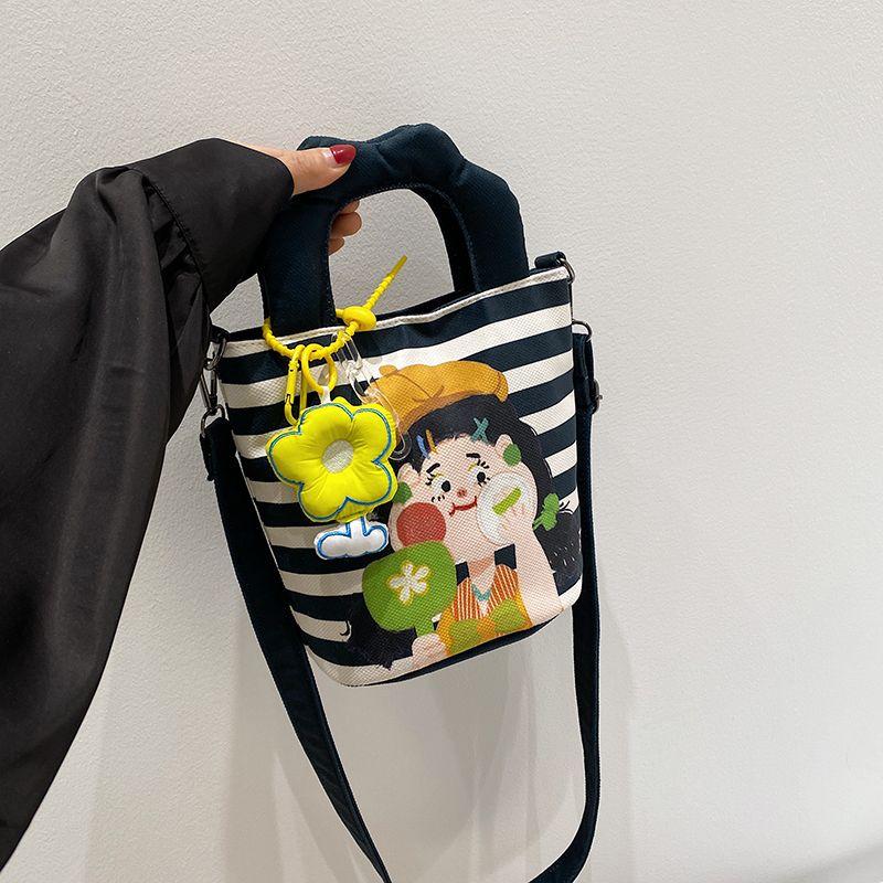 

Canvas Small Bag 2025 New Cute Cartoon Painting Bag Girl Carrying Bucket Bag All-Match Shoulder Messenger Bag Black [with green flower pendant]]