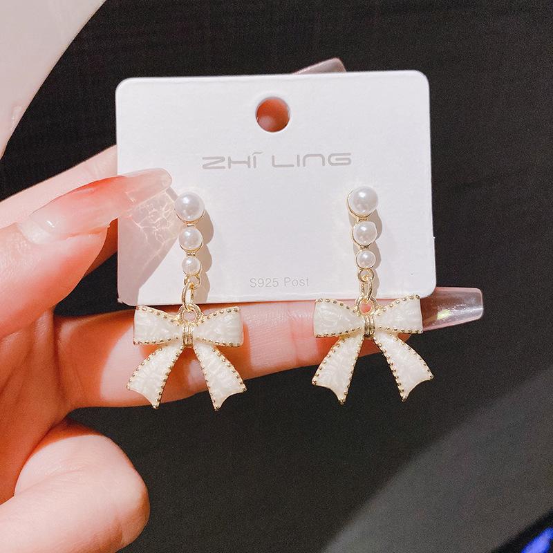 Silver Needle New Super Fairy Temperament Bow Earrings Women's Light Luxury Niche Versatile Pearl Stud Earrings