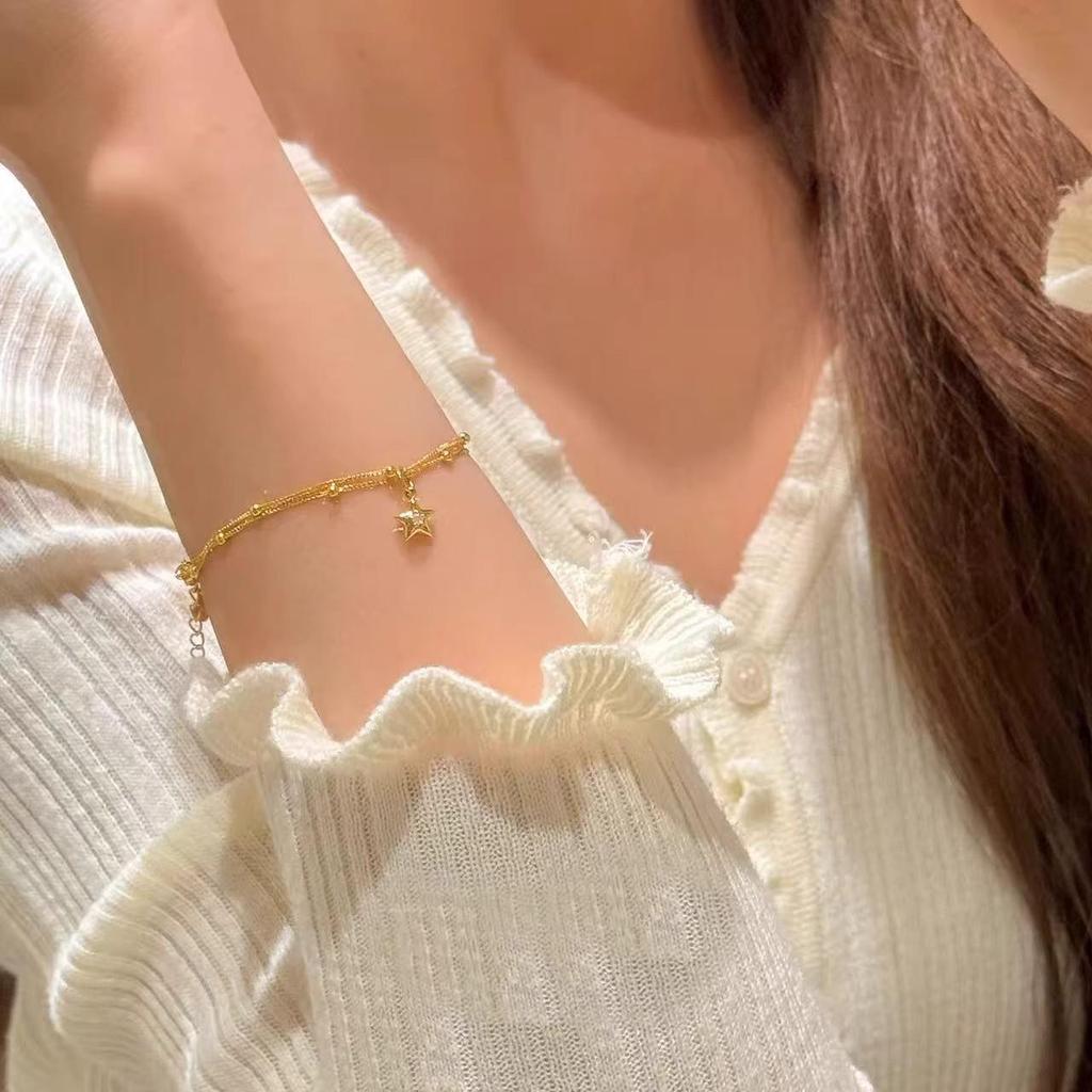 Gold Double-Layer Star Pendant Bracelet for Women - Small Wrist Design, Unique & Elegant.
