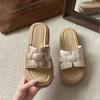 Woven thick-soled one-word slippers for women's summer wear new fashionable and versatile skirts, beach cool slippers