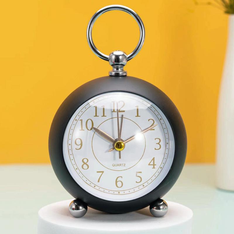 Silent Metal Alarm Clock with Night Light and Gold Stamped Spherical Face - Perfect for Students and Children.