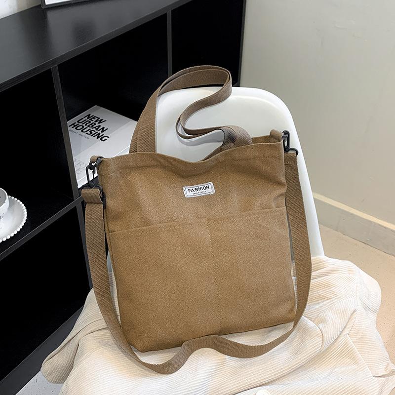 

Canvas bag new women s merchandise Guochao vertical messenger bag boys small backpack versatile ins shoulder bag