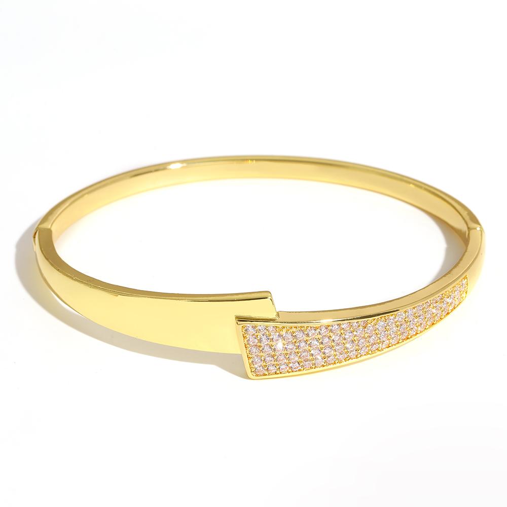 Luxuriöses funkelndes Strass-Armband, goldplattiert, für Damen, exquisites unregelmäßiges geometrisches Schleifenmanschetten-Federarmband Schmuck