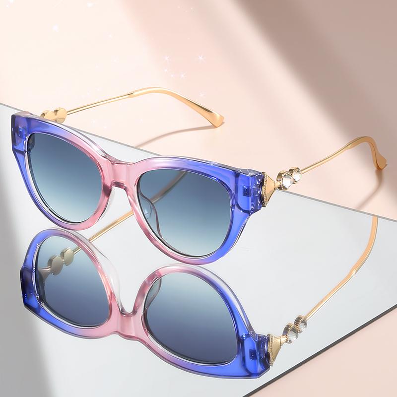 New cat-eye sunglasses with diamond-like embellishments on metal temples for a high-end versatile look