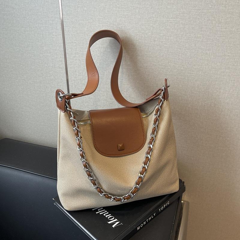 

Корейська версія модної повсякденної жіночої сумки-тоут 2024 року, нової універсальної сумки через плече великої місткості, для роботи та щоденних поїздок. коричневий