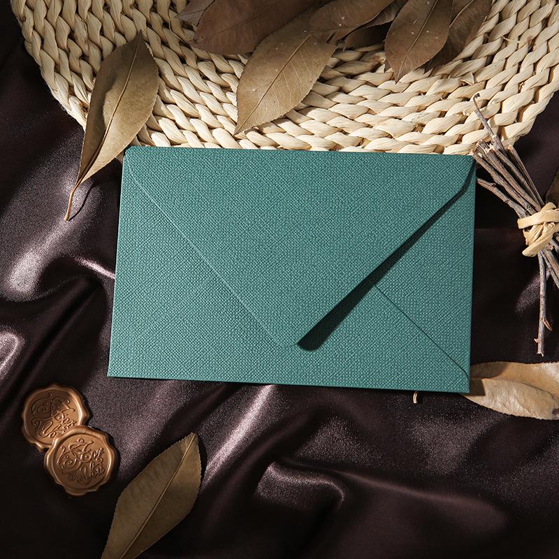 Retro Chinese Linen Pattern Letter Set with Kraft Paper, Sealing Wax, and Envelopes.