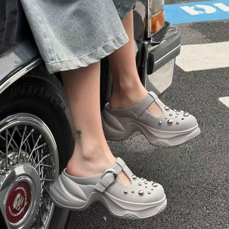 Fashion leather outer wear round head hole shoes women's new thick sole height increase small rivet hollow bag head drag