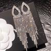 Trendsetting Rhinestone Tassel Earrings: Face-Slimming, Exaggerated Sparkle Design