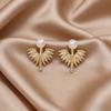 Light luxury pearl stud earrings women's niche design sense love bow earrings versatile earrings commuting