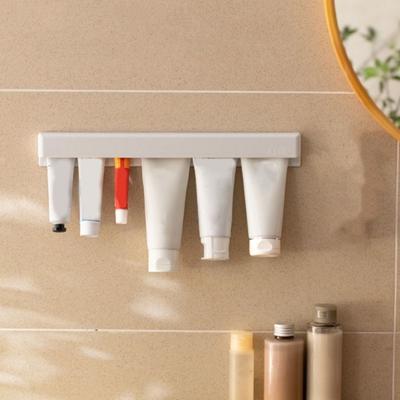 Selbstklebender Langzahnpasta-Halter Wandmontiert Platzsparend Zahnpasta-Klammer Großes Fassungsvermögen Bohrfreie Zahnpasta-Organizer