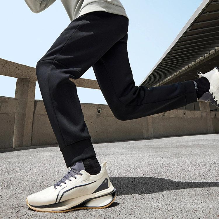 Li Ning Fitness Series Solid Color Non-Stretch Mid-Waist Tapered Knit Sports Pants Men Bottoms Black AKLT439-1